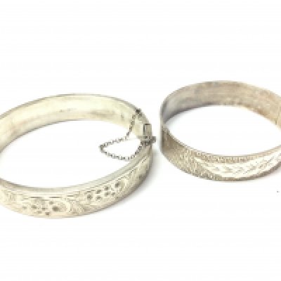 Two silver bangles. 67g total. Postage B