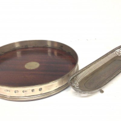 A Silver tray of rectangular shape with with a pierced patterned edge. Maker Thomas 153 New Bond St London hallmarks weight 240g and a large Mahogany and silver wine tray 26cm wide London hallmarks (2)