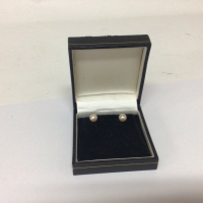 A pair of pearl stud earrings 9carat gold in a fitted box.