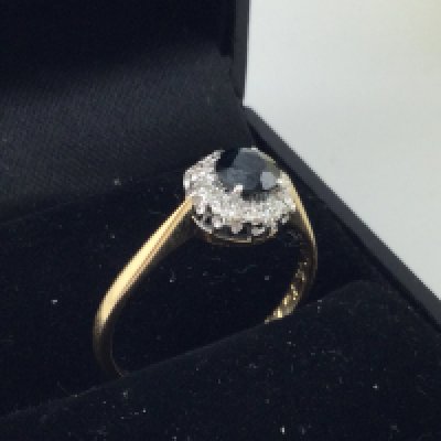 An 18ct gold sapphire and diamond set ring. Approx weight 2.7 grams, size P.