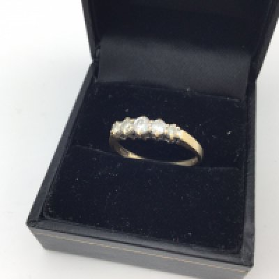 A 9ct gold diamond set ring. Approx size p.