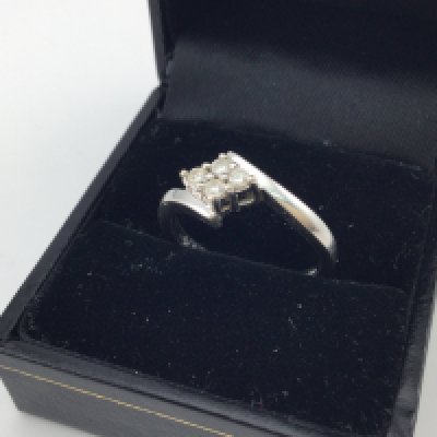 A 9ct white gold diamond ring. Approx weight 3.3 grams, size P.