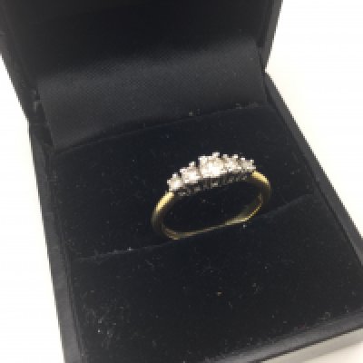 An 18ct gold five stone diamond ring.