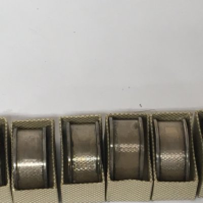 A set of six silver napkin rings in fitted boxes no personal inscriptions and with Birmingham hallmarks.