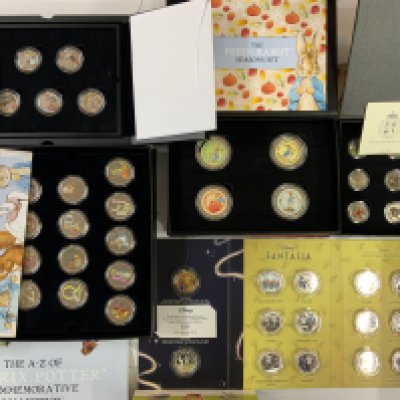A collection of cased presentation coin sets (B)
