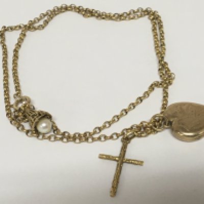 A 9carat gold chain with attached 18carat gold cross and a gold front and back locket and small pearl pendant attached. Total weight 15.5g