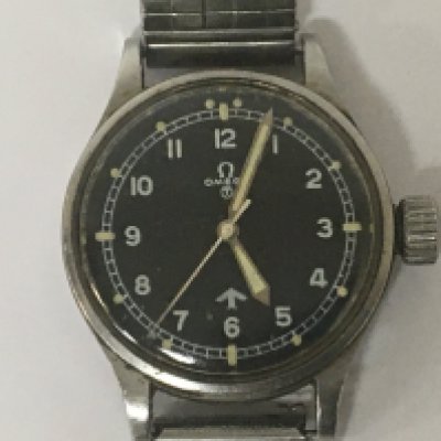 A rare and guaranteed to be original Omega RAF 1953 6B/542 Fat Arrow watch antimagnetic and Chronometer certified watch. With black dial illuminated hands and batons and enlarged adjustment crown This watch was one of just 5900 made a special order from the MOD direct from Omega. They where given to jet fighter pilots other RAF pilots and a select number of senior officers. The watch seen working.The reverse with MOD RAF. 6645 101000/53 movement serial number 12802920.
