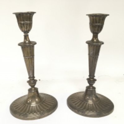 A pair of Neo classical design George III style silver candle sticks with oval loaded base London hallmarks.