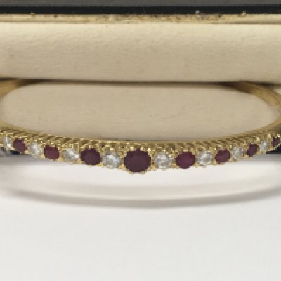 A 18 ct bracelet inset with ruby and diamond total weight 15.48 grams fitted in original box .