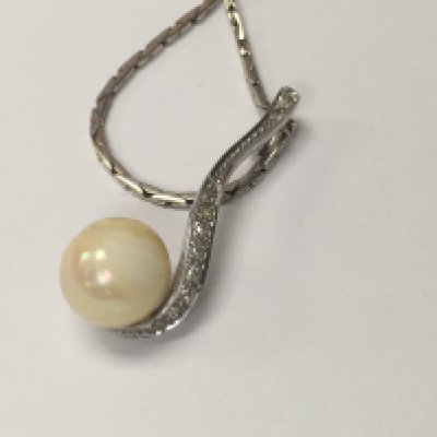 A 18 ct white gold necklace with attached diamond and pearl pendant. Total weight