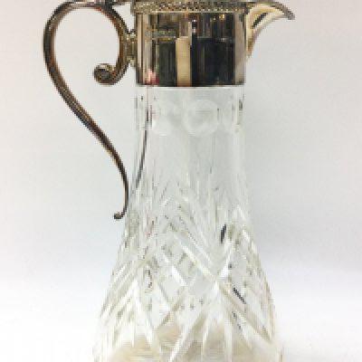 A silver hallmarked and cut glass claret jug , 27cm tall. This lot cannot be posted