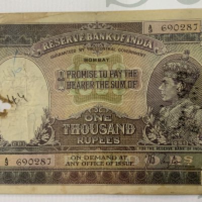 Reserve Bank of India, 1000 rupee, ND (1937), Bombay, serial number A/3 690287, purple, green and lilac, crowned head of George VI at right, Taylor signature, damage and some overprinting. (A)
