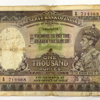 Reserve Bank of India, 1000 rupee, ND (1937), Calcutta, serial number A/O 714468, purple, green and lilac, crowned head of George VI at right, Taylor signature, discolour, hand writing and Printed stamp to reverse