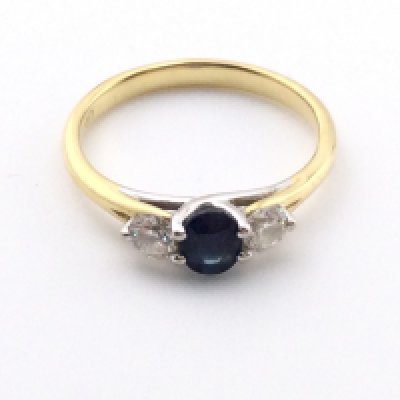 An 18k gold sapphire and diamond ring. 2.44g and size K 1/2.Postage A
