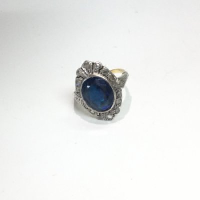 withdrawn - A 1920s ring set with a large sapphire in the centre with diamonds surrounded the central stone.