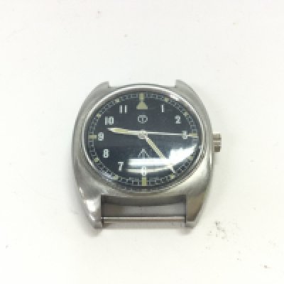 A wind up military watch with no strap. (Seen working)