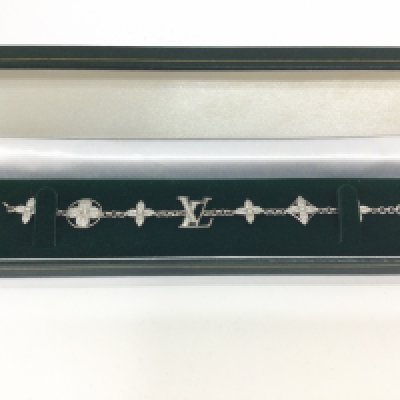 An LV 18ct white gold and diamond bracelet. Approx weight 17.82 grams.