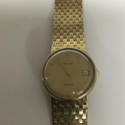 A Gents 9carat gold Bulova watch with date aperture full gold strap quartz movement not seen working weight 62g