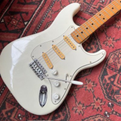 A 1970's CMI Lawsuit era copy of a Fender Stratocaster electric guitar in white with all original parts. Made at the Matsumoto Factory. Slight wear and damage to the vibrato arm tip otherwise in very good overall condition with play wear consistent with age and use. <a href="https://www.the-saleroom.com/en-gb/auction-catalogues/staceys-auctioneers-and-valuers/catalogue-id-srsta10351/lot-fdaa2e46-ee1b-41a4-bdc3-b2410115227f"> Click Here to Register to bid </a>