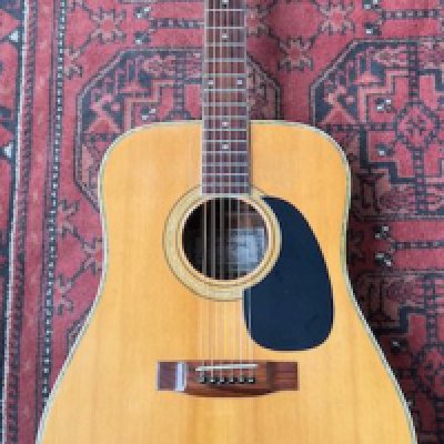 A 1980's Kiso Suzuki KW150 Dreadnought guitar in good condition with playwear to the top. Mother of pearl binding and three piece back. <a href="https://www.the-saleroom.com/en-gb/auction-catalogues/staceys-auctioneers-and-valuers/catalogue-id-srsta10351/lot-64fb5172-aefa-403b-95f3-b24101152535"> Click Here to Register to bid </a>