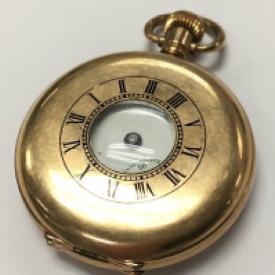 A gold plated watch . Postage category A