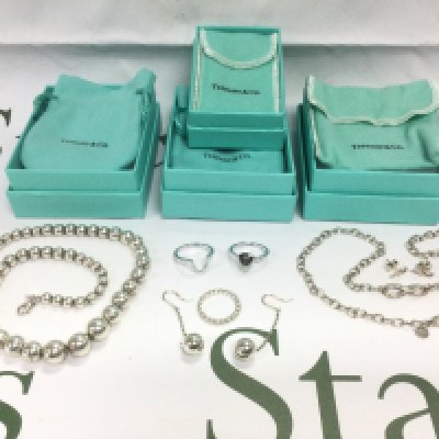 A collection of boxed Tiffany & Co jewellery. Shipping category A.