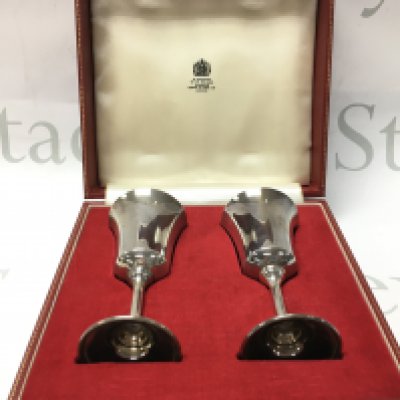 A cased pair of silver hallmarked wine cups . Postage category B