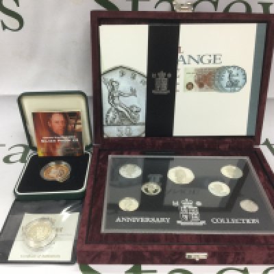 A cased Royal Mint Anniversary Coin Collection and two silver proof coins. Shipping category B.