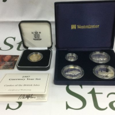 Two cased silver proof coin sets comprising a 1997 Guernsey Year set and a Piedfort &pound;2 coin. Shipping category A.