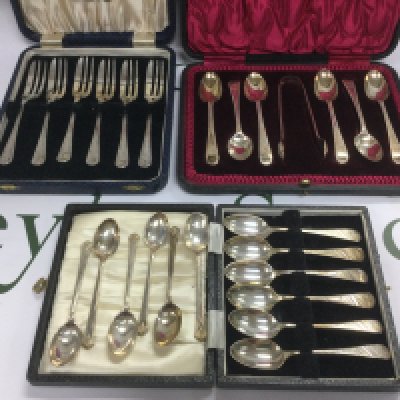 Three cased sets of silver cutlery. Shipping category B.