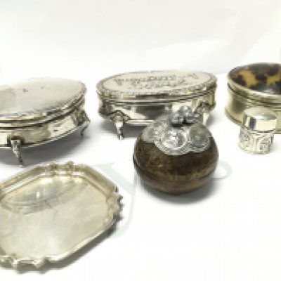 A collection of silver hallmarked trinket boxes including a Thai style wooden bowl box. Postage category B
