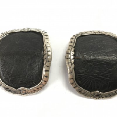A leather and silver pair of belt buckles . Postage category A. NO RESERVE