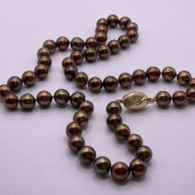 Necklace strung with chocolate coloured freshwater cultured pearls with an oval shaped 9ct yellow gold stain/polished style clasp. Postage category A.