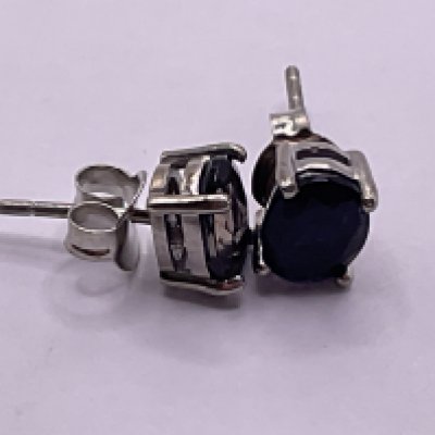 Pair of iolite studs in silver. Postage category A.