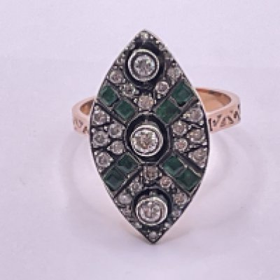 Unhallmarked rose gold and silver topped navette shaped shaped ring set with RBC diamonds and square step cut emeralds. Diamonds 0.60ct approx. Emeralds 0.20ct approx. Ring size approx N/O. Postage category A.