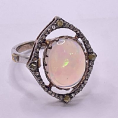 Silver gilt dress ring set with oval cabochon opal and yellow rose cut diamonds and white rose cut diamonds. Opal 3.05ct. Diamonds 0.40ct. Ring size approx O/P. Postage category A.