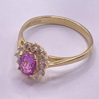 18ct yellow gold oval pink sapphire and RBC diamond cluster ring. Pink sapphire 0.65ct approx. Diamonds 0.50ct approx. Ring size approx R. Postage category A.