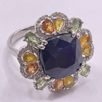 Floral style silver dress ring set with a central cushion cut blue sapphire (glass filled), surrounded by multi coloured sapphires and diamonds. Sapphires 12.00ct total, approx. Diamonds 0.40ct approx. Ring size approx N. Postage category A.