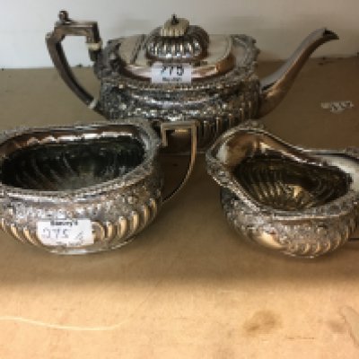 A four piece silver tea set comprising tea pot hot water pot milk jug and sugar bowl 2,3 kilo Sheffield hallmarks.