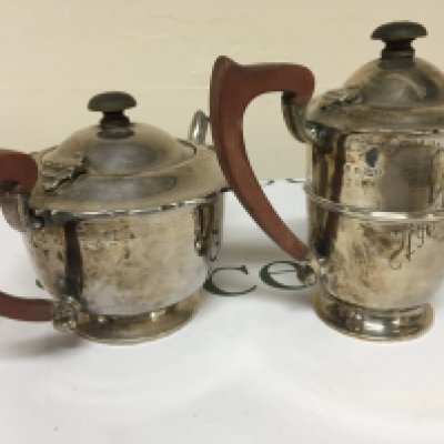 A silver tea pot and silver hot water jug with wooden handles Birmingham hallmarks weight 700g