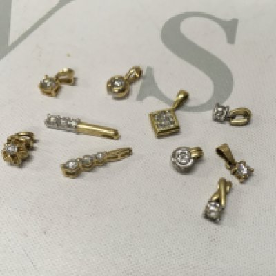 A small assortment of stone set 18ct gold pendants. Approx weight 8.8 grams.