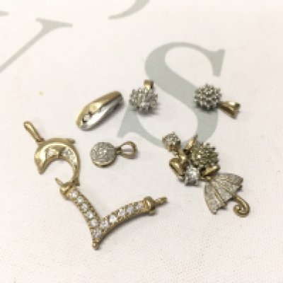 An assortment of stone set 9ct gold pendants. Approx weight 6.9grams.