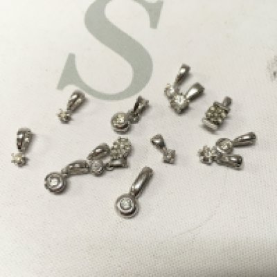 An assortment of 9ct hire gold stone set pendants. Approx weight 6.9grams.