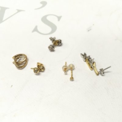 Five pairs of 18ct gold stone set studs. Approx weight 8.8 grams.