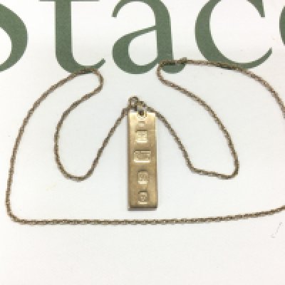 A 9ct gold ingot and chain, approx 18.2g. Shipping category A.