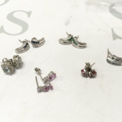 Six pairs of 9ct white gold stone set studs. Approx weight 9.6 grams.