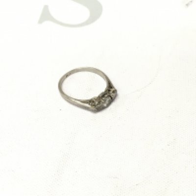 A platinum three stone ring, Approx size J, Approx weight 1.9 grams.
