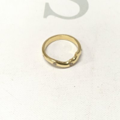 A gold stone set fancy style band. Approx weight 2.2 grams, size K.