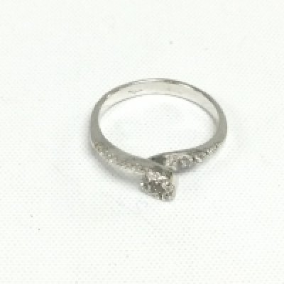 An 18ct white gold loop design ring set with diamonds. Approx 2.5g and approx size O. Shipping category A.
