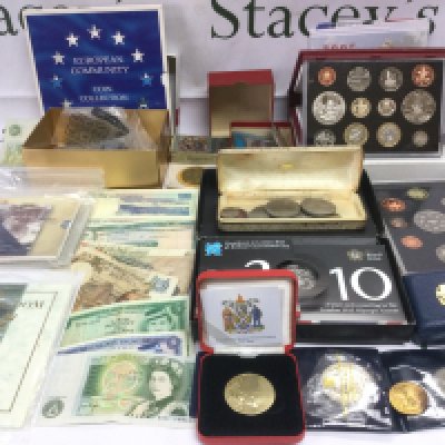 A box of coins and bank notes including proof sets. Shipping category B.